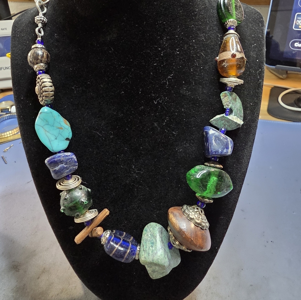 bohemian-style statement necklace, potentially from the brand Treska,